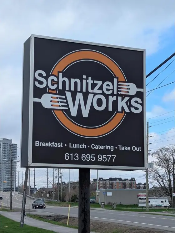 The Schnitzel Works sign on Cyrville Road: Breakfast, Lunch, Catering, Take Out